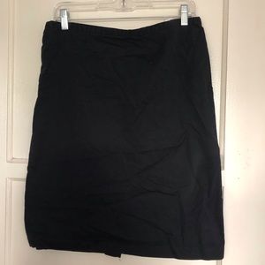 Knee length black skirt.